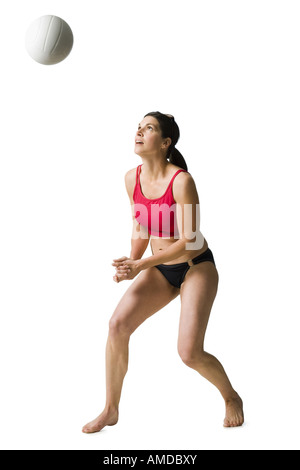 Woman in bikini playing volleyball Stock Photo