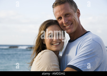 Man and woman hugging on beach Stock Photo