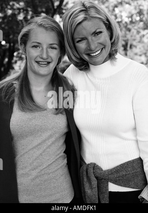 Portrait of Mother and Daughter Standing Outdoors Stock Photo