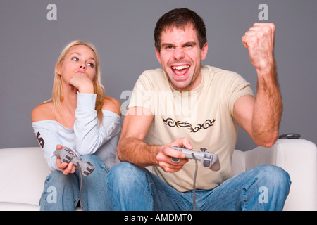 Young couple playing video game Stock Photo