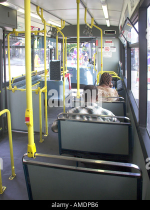 Back view of people sitting interior of single deck transport for London tfl public transport passenger bus service London England UK Stock Photo