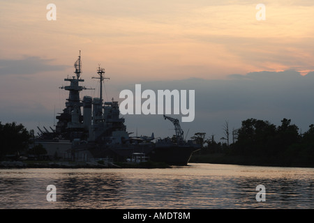 Battleship North Carolina at sunset on Cape Fear in Wilmington North Carolina Stock Photo