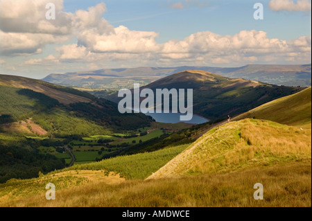 Female hiker on Pant y Creigiau looking over Glyn Collwn and Talybont reservoir Brecon beacons Wales UK Stock Photo
