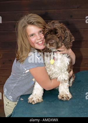 USA OREGON BEND A young girl with her cocker spaniel dog Stock Photo