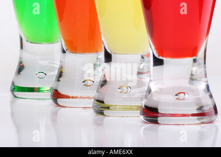 Four  glasses of Kool aid drink Koolaid poured in a glass nobody none on white table background close up  front view horizontal hi-res Stock Photo