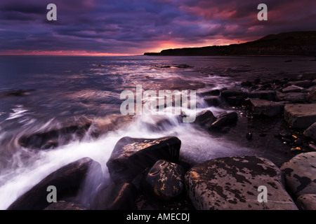 Low-light image of Kimmeridge Bay using a long shutter speed to smooth out the ocean and make the image look more serene. Stock Photo