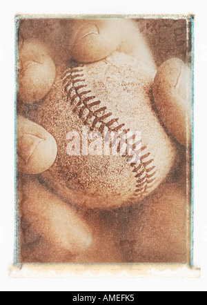 Close-Up of Hand Holding Baseball Stock Photo