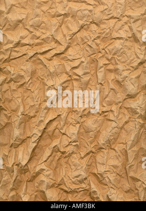 very wrinkled sheet of brown paper with rough texture Stock Photo