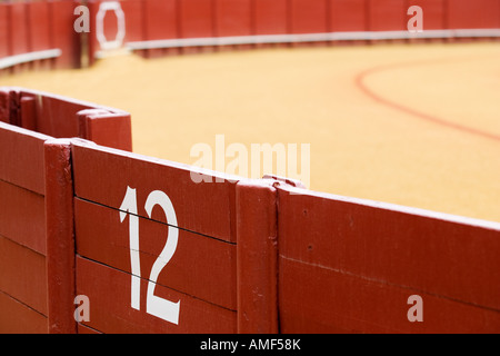 The number 12 on the bullring barrier. Stock Photo