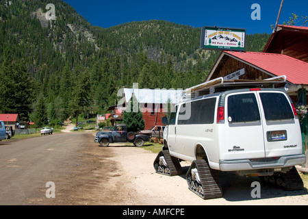 A van equipt with tracks instead of tires for driving in the snow at Yellow Pine, Idaho. Stock Photo