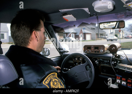 High school teenagers arrested by police for drinking alcohol while driving a car Stock Photo