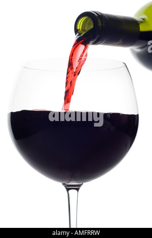 Red wine pouring down from a wine bottle clipping path included against white background Stock Photo