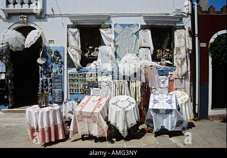 Lace gifts and souvenirs for sale outside a shop on the island of Burano, Venice, Italy Stock Photo
