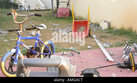 Israel Sderot house damaged by a Qassam rockets launched by Hamas from Gaza damaged children toys May 8th 2007 Stock Photo