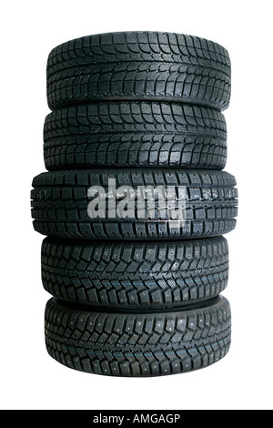 Brand new tires stacked up and isolated on white background Stock Photo
