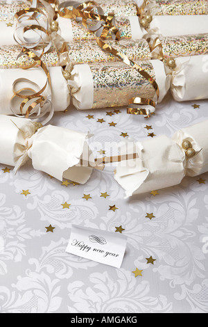 Festive party crackers with a Happy new year note Stock Photo