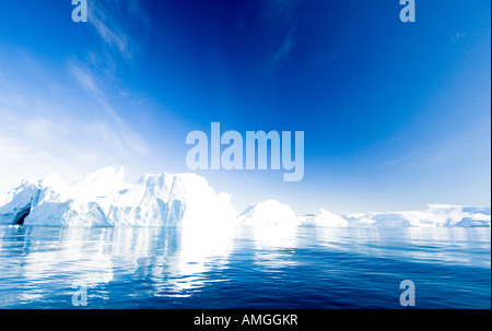 Huge blue icebergs stranded on Icefjeldsbanken Disko Bay Ilulissat or Jacobshavn Greenland World heritage site Stock Photo