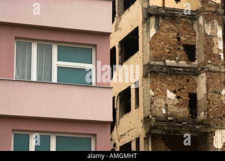 A rebuilt building next to a bombed out building. Mostar, Bosnia & Herzegovina. (Nov 2007) Stock Photo