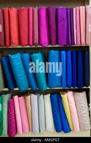 Multi-coloured Swatches of Thai silks on shop shelves Thailand, Asia, Piankusol Ltd Stock Photo