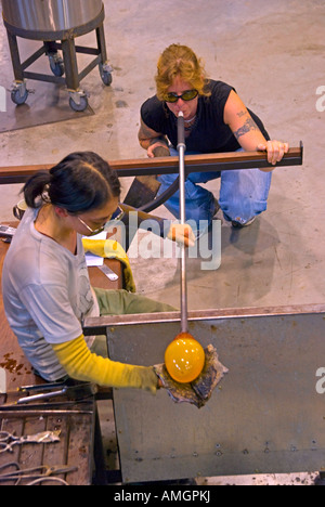 Glass blowers at work in the Canberra Glassworks Stock Photo