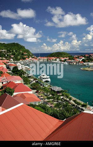 Red roof buildings surround Gustavia Harbour St Barts Stock Photo