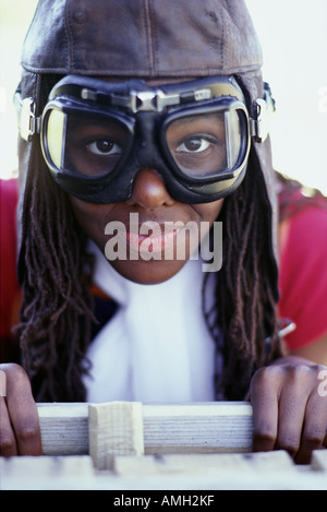 Portrait of Girl Wearing Goggles Sitting in Soapbox Car Stock Photo