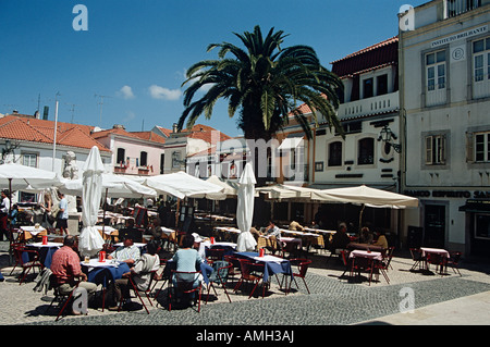 Diners dining outside a restaurant in Rua da Palma, one of the town squares, Cascais, near Lisbon, Portugal Stock Photo