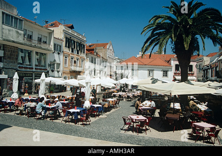 Diners dining outside a restaurant in Rua da Palma, one of the town squares, Cascais, near Lisbon, Portugal Stock Photo