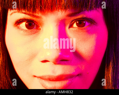 Oriental womans face close up Stock Photo