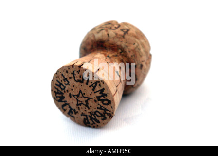 A champagne cork on a white tablecloth background Stock Photo