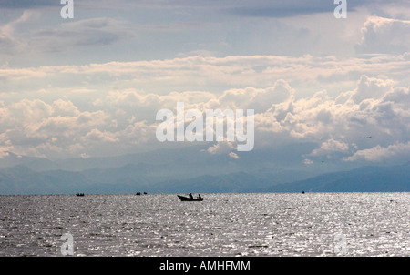 Fishermen and storm clouds Stock Photo