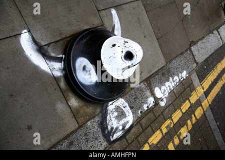 a piece of street furniture is changed into a cow, near Brick Lane, East London Stock Photo