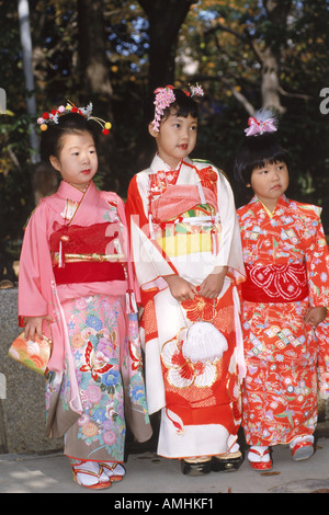 Children dressed in kimonos at Kitano Jinja Shrine during festival in Kyoto Japan Stock Photo