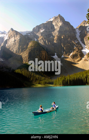 Canoes on Moraine Lake Banff National Park Alberta Canada Canadian Rockies Canadian Rocky Mountains Stock Photo