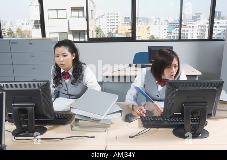 Two office workers in office Stock Photo