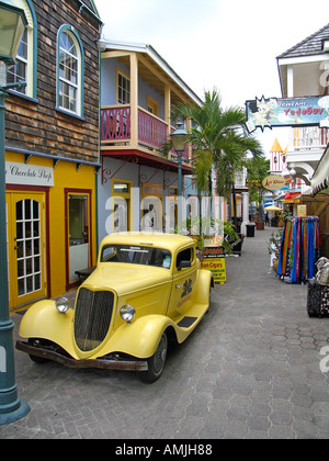 Vintage vehicle and boutiques Old Street shopping St Maarten Stock Photo