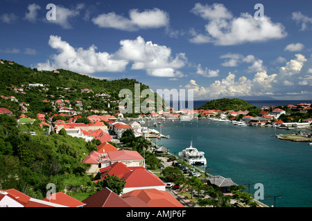 Red tin roof buildings surround attractive Gustavia Harbour St Barts Stock Photo