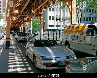 Traffic under the downtown elevated railway The Loop Chicago Illinois USA Stock Photo