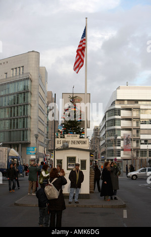tourists at checkpoint charlie ersatz cabin reconstruction in the middle of Friedrichstraße Berlin Germany Stock Photo