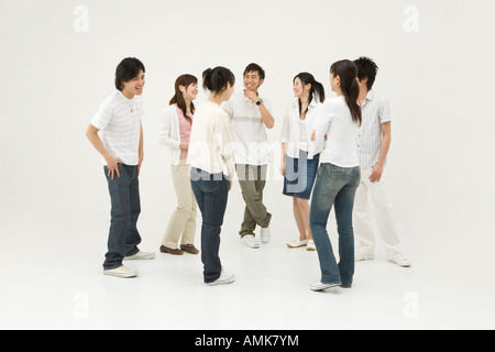Young people standing in circle Stock Photo