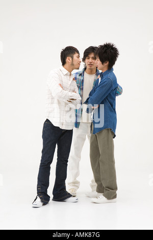 Three young men arguing Stock Photo - Alamy