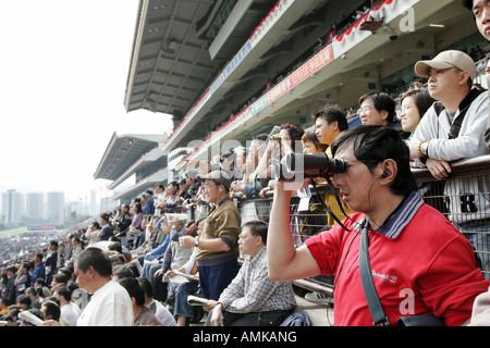 People at the Sha Tin race course in Hong Kong Stock Photo
