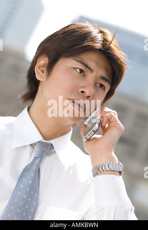 Young businessman using mobile phone Stock Photo