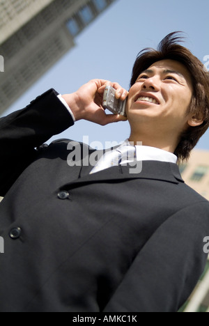 Young businessman using mobile phone Stock Photo