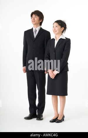Portrait of young couple wearing suit Stock Photo