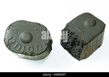 Brown coal or lignite, two bricketts, studio picture Stock Photo