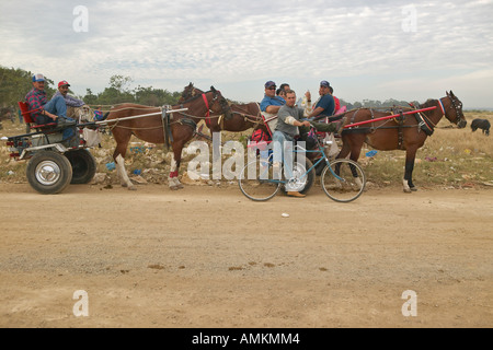 Horses and carriage taking townspeople home from El Rincon Cuba Stock Photo