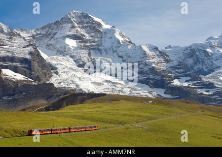 Jungfrau with train from Kleine Scheidegg. Grindelwald. swiss alps, Switzerland Stock Photo