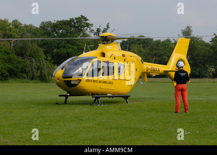An air ambulance helicopter attending an emergency. Stock Photo