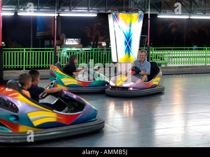 Father and Daughter in Dodgem Cars Nettuno Park Funfair Sicily Italy Stock Photo